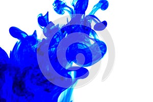 blue ink in water on white background.Blot ink. Blue paint on a white background.Color drop swirling.