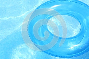 Blue inner tube on blue water