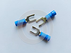 Blue insulated cable lugs and fork type.