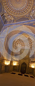 Blue interior of mosque dome with gold gild of Tile Karl Madrasa photo