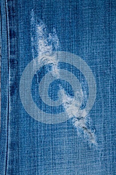 Blue Jean texture with a hole and threads