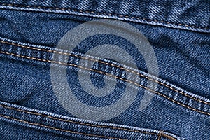 Blue jeans apparel and brown cord fabric background texture, cloth garment concept