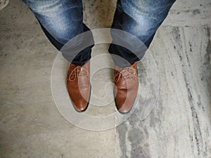 Blue jeans and Brown leather shoes