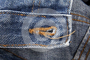 Blue jeans with buttonhole