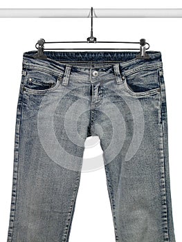 Blue jeans on a closet rod