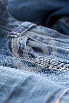 Blue jeans denim fabric close up - jeans fashion concept background