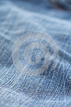 Blue jeans denim fabric close up - jeans fashion concept background