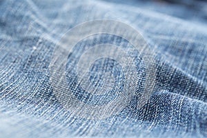Blue jeans denim fabric close up - jeans fashion concept background