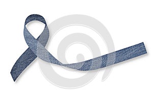 Blue jeans denim ribbon isolated with clipping path on white background for genetic disorder awareness and children`s rare photo