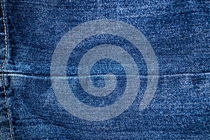 Blue jeans fabric background texture. Close up view, denim