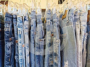Blue Jeans Hanging On Hangars