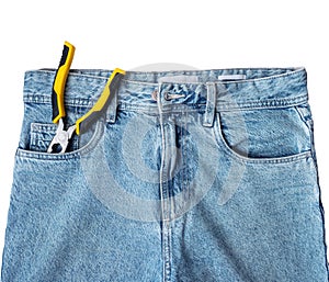 Blue jeans with pliers in the pocket