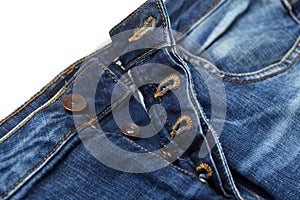 Blue jeans with pocket.Brown seam denim and silver button jeans and on old blue jeans denim texture close up.