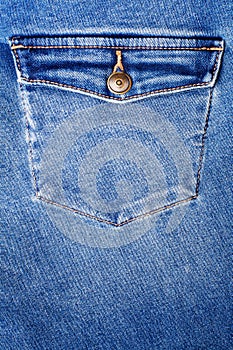 Blue jeans pocket with flap and brass metal button close up, jeans pocket background, blue denim backdrop, jeans pocket pattern
