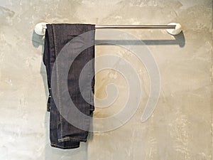 Blue jeans on the rail.