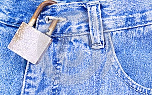 Blue jeans with rusty padlock