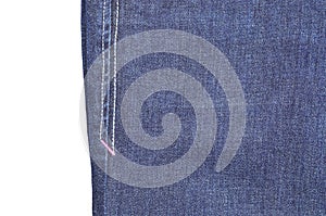 Blue jeans side seam on white background