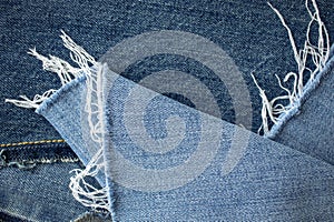 Blue jeans texture or denim background with seam and thread