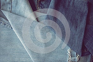 Blue jeans texture or denim background with seam and thread