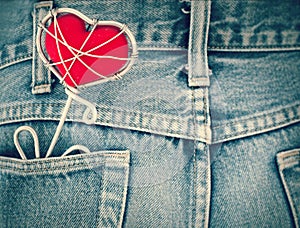 Blue jeans texture pocket and red heart,