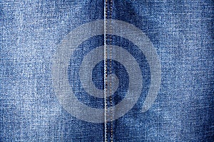 Blue jeans texture and seam close up, thread stitch line, jean textile background, blue denim backdrop, faded jeans pattern shabby