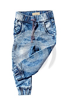 Blue jeans trousers isolated on white background. Fashionable jeans for child boy. Left trouser leg folded. Top view front.