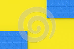 Blue jigsaw puzzle pieces on yellow background. Copy space. Top view