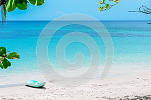 Blue kayak by the beach in Bequia island in Saint Vincent and the Grenadines.