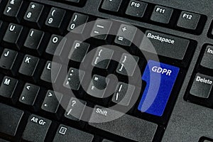 blue keyboard key with text GDPR as symbol for Privacy and General Data Protection Regulation on a notebook computer