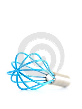 Blue kitchen whisk front view