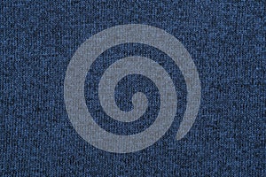 Blue knitted jersey texture. Dark blue knit cloth background