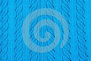 Blue knitted sweater close-up. Background, pattern and texture