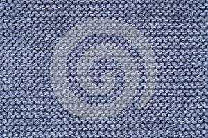 Blue knitted texture of a scarf or winter sweater