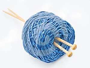 Blue knitting yarn on white background