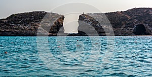 The Blue Lagoon at boat level with Cominotto island in background