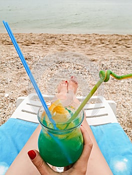 Blue lagoon cocktail on the beach