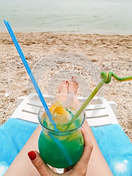 Blue lagoon cocktail on the beach