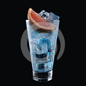 Blue lagoon cocktail with Blue Curacao liqueur in a tall glass isolated on black background. Classic alcoholic cocktail