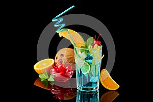 Blue Lagoon cocktail with a slice of melon and cherry isolated on white