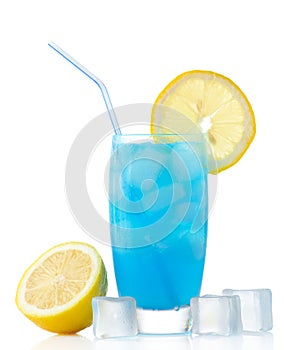 Blue lagoon drink with lemon,straw and ice cubes on white