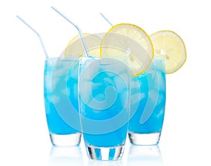 Blue lagoon drinks with slice of lemon with straw isolated on white