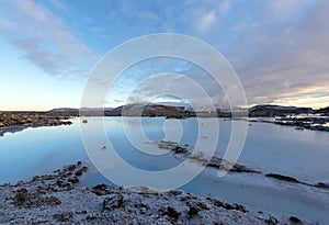 The blue lagoon in Iceland. The blue water between the lava stones at winter.