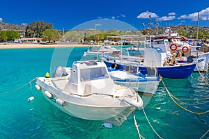 Blue lagoon of Marathi bay with fishing boats on Crete, Greece