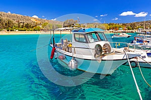 Blue lagoon of Marathi bay with fishing boats photo