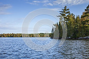 Blue lake in the Boundary Waters of northern Minnesota on a bright autumn morning