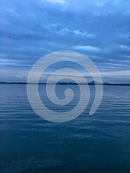 Blue lake with cloudy sky at twilight time for background and copy space