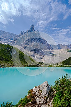 blue lake in the dolomites, lago di sorapis in italy at daylight