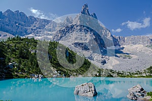 blue lake in the dolomites, lago di sorapis in italy at daylight