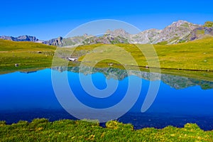 blue lake among green mountain valley