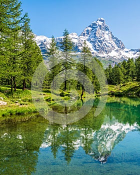 Blue Lake with the Matterhorn reflecting on the water, Valtournenche, Aosta Valley, Italy.